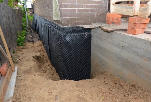 Happy homeowners after waterproofing job in Sussex
